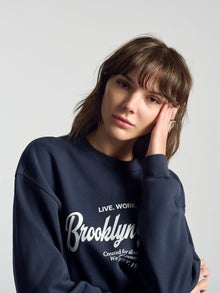 Women's BKI 1998 Crew Neck Sweatshirt In Total Eclipse - BROOKLYN INDUSTRIES